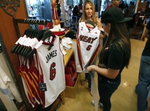 A guest purchases a LeBron James jersey at a store in Miami